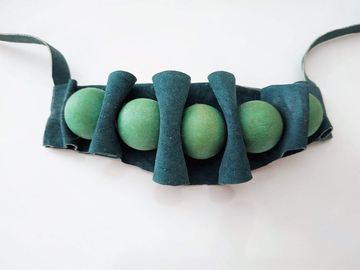Modern necklace made of green suede and green wooden balls - GLEZANT designer goods store.