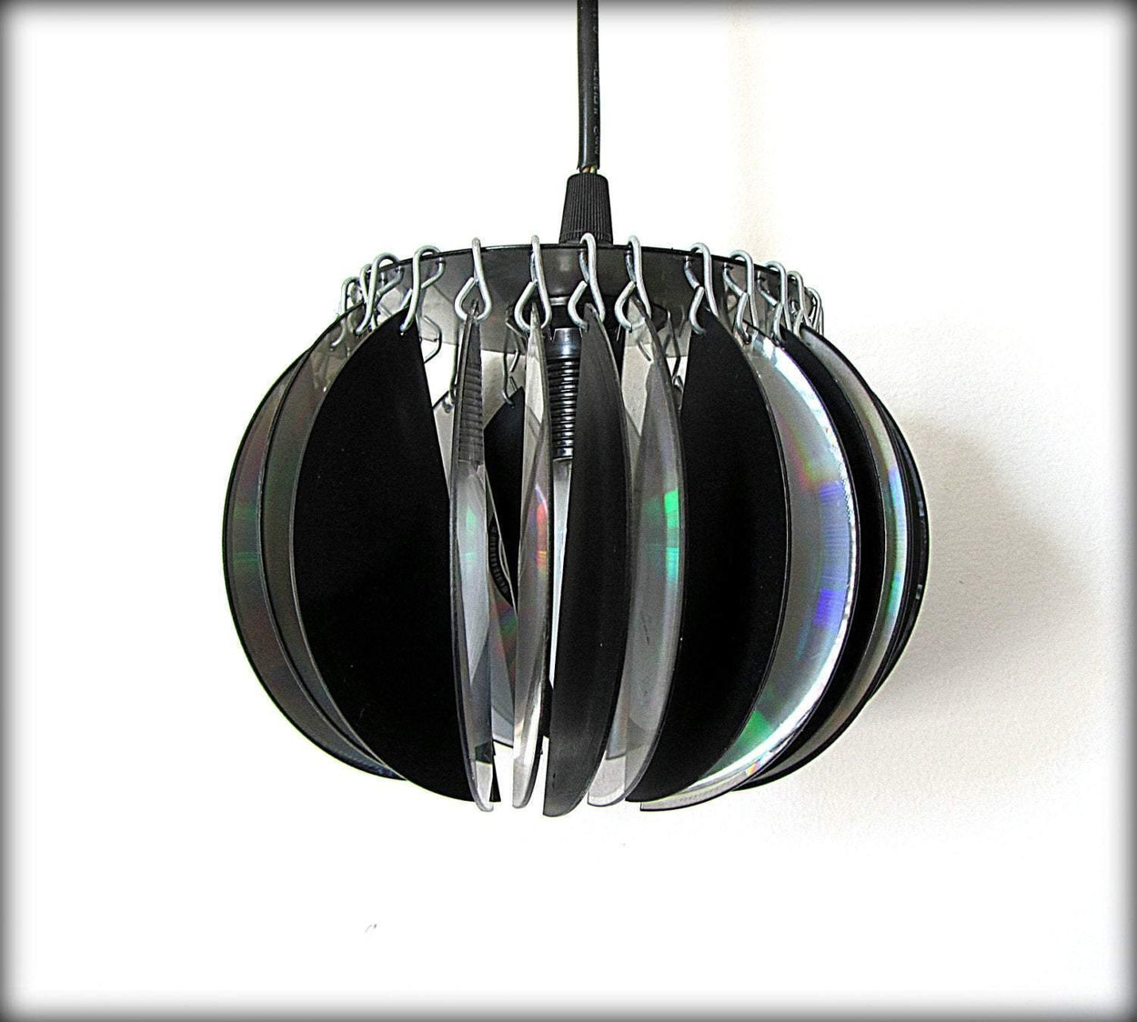 Lampshade from computer discs and a similar ceiling suspension lamp - GLEZANT designer goods store.