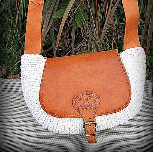 Crossbody / Shoulder bag made out of thick leather with a knitted fragment on a long leather strap - GLEZANT designer goods store. 