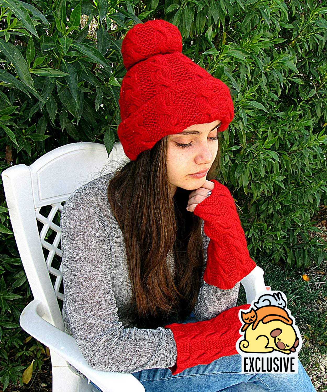 Knitted red set: a pom-pom cap and fingerless gloves/gaiters - GLEZANT designer goods store.