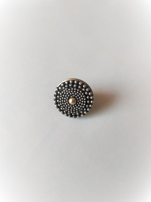 Unique white metal ring with a yellow metal ball in the center