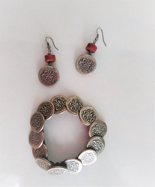 Handmade set of "old coins". Earrings with coral and bracelet