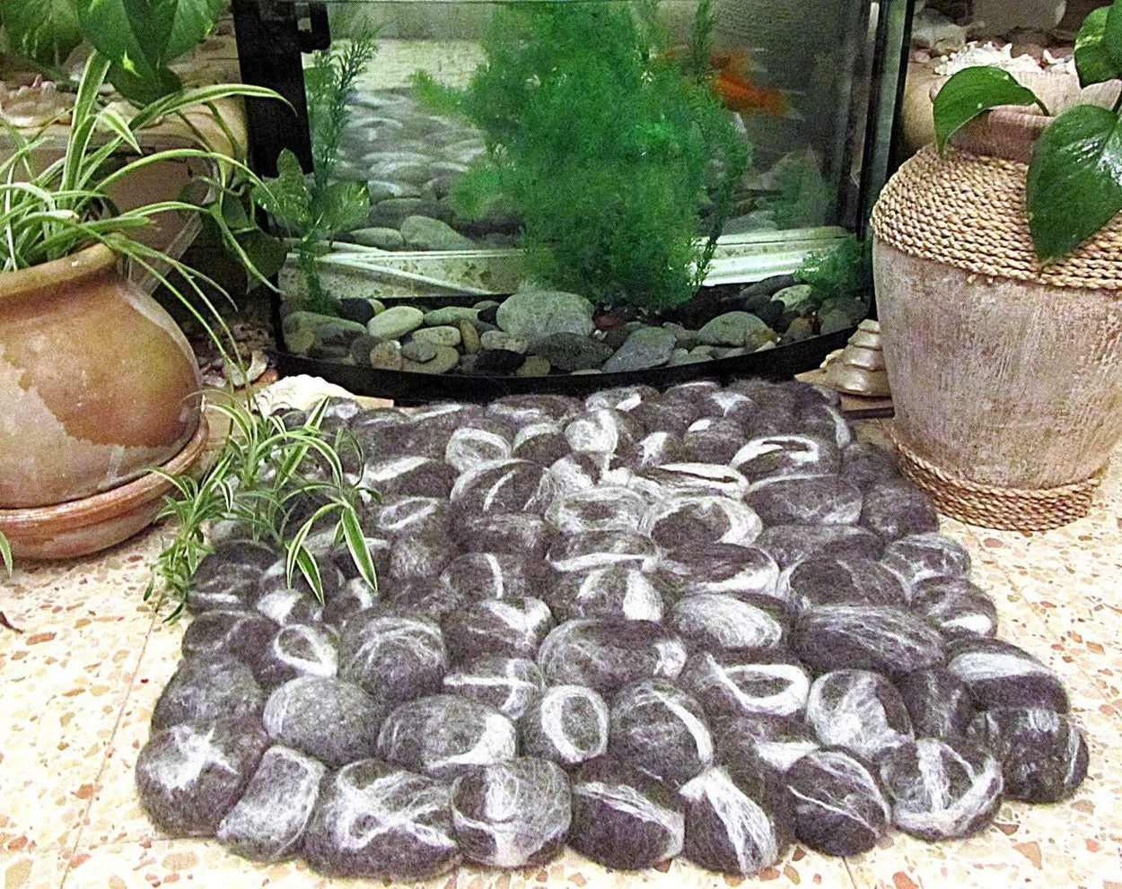 Spectacular alpaca felt rug handmade in the form of pebbles - GLEZANT designer goods store. 