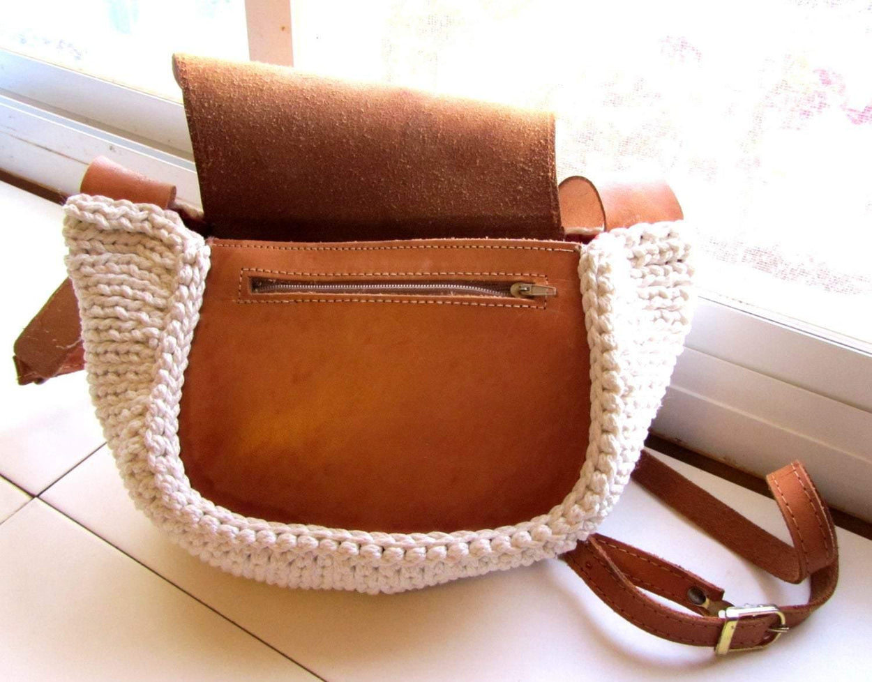 Crossbody / Shoulder bag made out of thick leather with a knitted fragment on a long leather strap - GLEZANT designer goods store. 