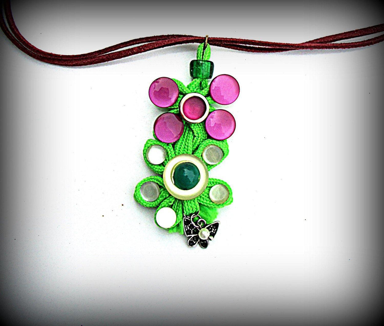 Pendants of two types made of various buttons and a green cord. Summer fun necklaces made of various buttons. - GLEZANT designer goods store. 