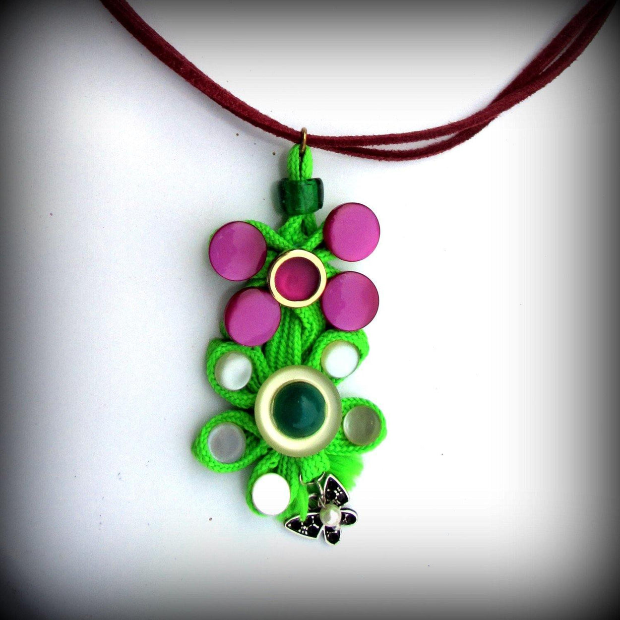 Pendants of two types made of various buttons and a green cord. Summer fun necklaces made of various buttons. - GLEZANT designer goods store. 